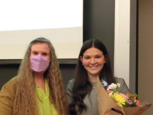 smiling face, masked individual bouquet of flowers